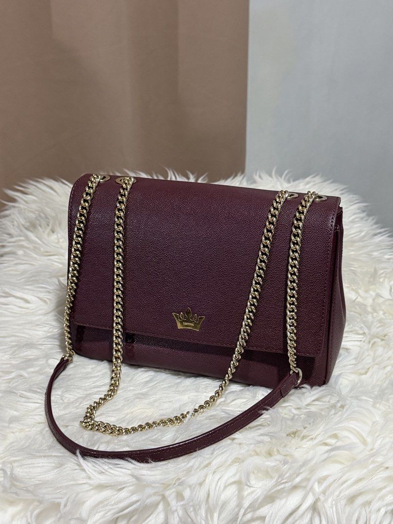 j.estina Chain Sling Bag (Category: Shoulder Bags) located in Marikina City. Submitted by welllovedbycarina (Listing ID 1460547487, Image 1). Description: Original J.Estina, preowned from Korea Color is burgundy / red wine 🍷 The strap is convertible from shoulder to crossbody length Gold tone hardware Ready to ship from Marikina City Small size Dimensions: 25cm x 16cm x 8cm BAG CONDITION • Overall Condition: Excellent • Leather/Material: Excelle