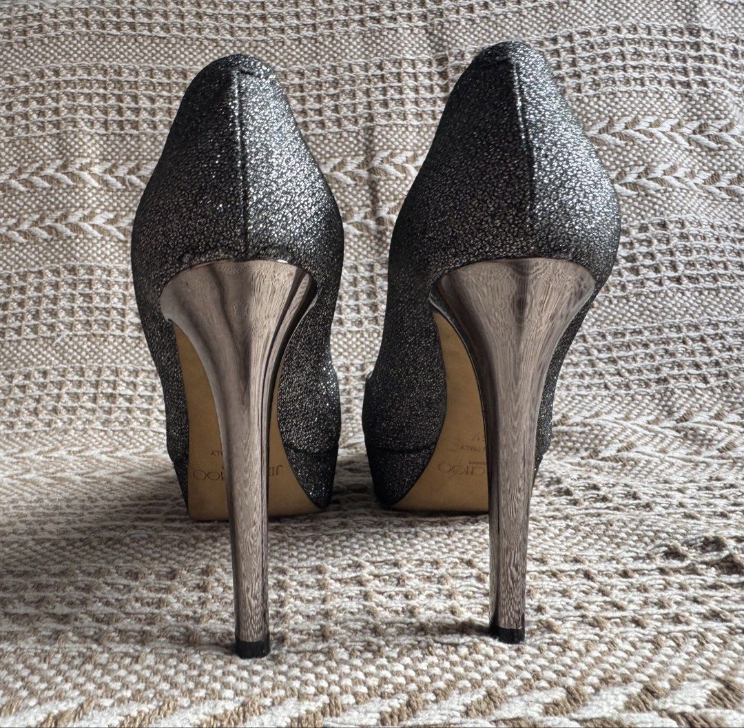 JIMMY CHOO Platform pumps, Size 6 (23cm) (Category: Heels) located in Manila. Submitted by heeasaiao (Listing ID 1460629315, Image 3). Description: Jimmy Choo glittery platform pumps with a sleek rounded toe, metallic high stiletto heel, and elevated platform sole. DETAILS Brand: Jimmy Choo Color: Silver Style: Platform Pumps Size: 35.5 (on shoe) : 23cm (measured) Metallic Silver High Stiletto Heel Platform Sole Made in Italy worn sole and light 
