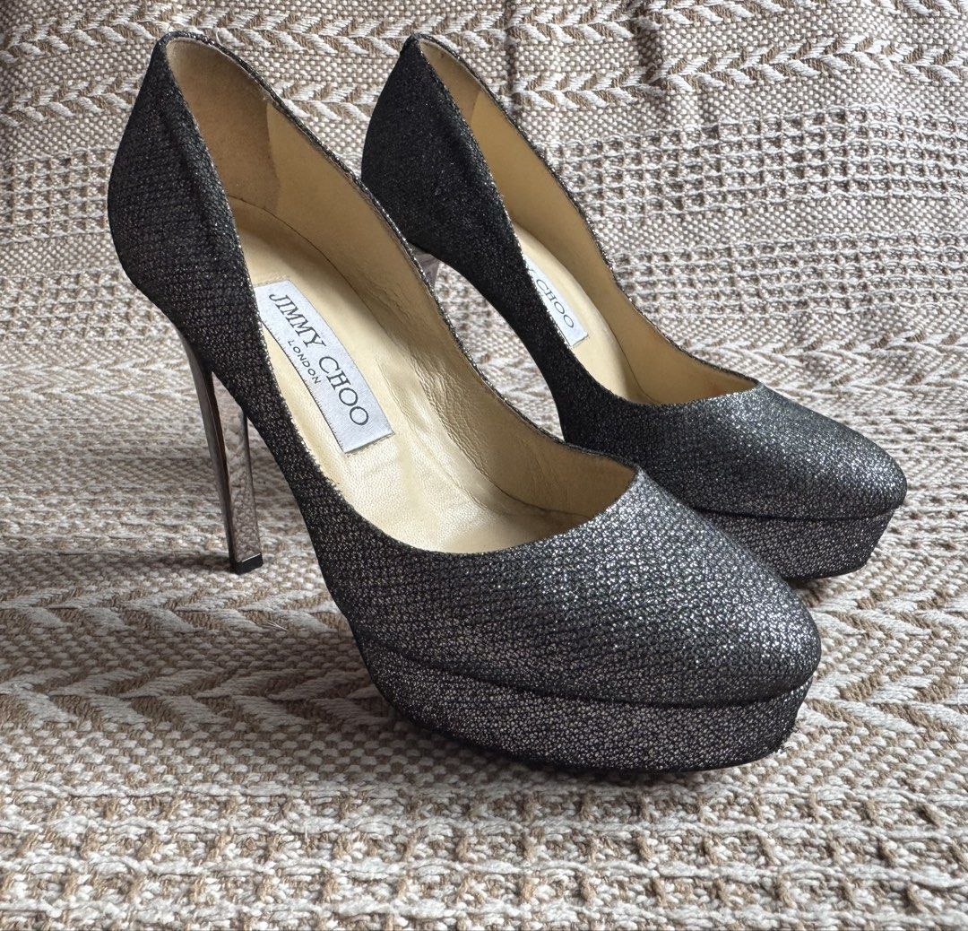 JIMMY CHOO Platform pumps, Size 6 (23cm) (Category: Heels) located in Manila. Submitted by heeasaiao (Listing ID 1460629315, Image 1). Description: Jimmy Choo glittery platform pumps with a sleek rounded toe, metallic high stiletto heel, and elevated platform sole. DETAILS Brand: Jimmy Choo Color: Silver Style: Platform Pumps Size: 35.5 (on shoe) : 23cm (measured) Metallic Silver High Stiletto Heel Platform Sole Made in Italy worn sole and light 
