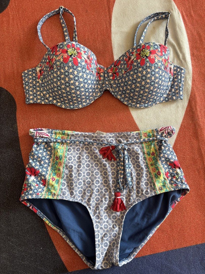 Johnny Was Bikini Set Size S (Category: Bikinis & Swimsuits) located in Alicia. Submitted by thriftbagph (Listing ID 1460659528, Image 1). Description: - Brand: Johnny Was - Style: Bikini Set - Size: S - Pattern: Blue and white floral accents - Bottoms: High-waisted with drawstring and tassels - Top: Adjustable straps - Ideal for: Beach vacations.