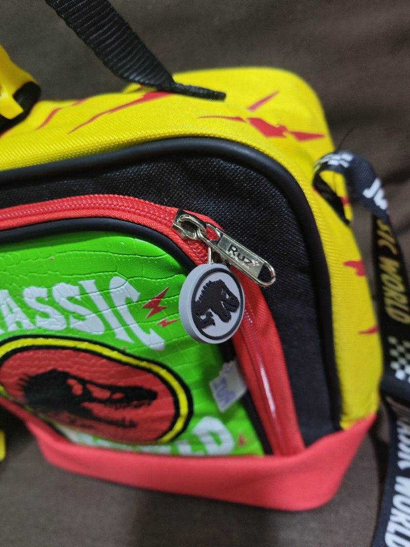 Jurassic world insulated sling bag (Category: Babies & Kids Fashion) located in Pili. Submitted by zaneombao03491 (Listing ID 1460642257, Image 3). Description: .