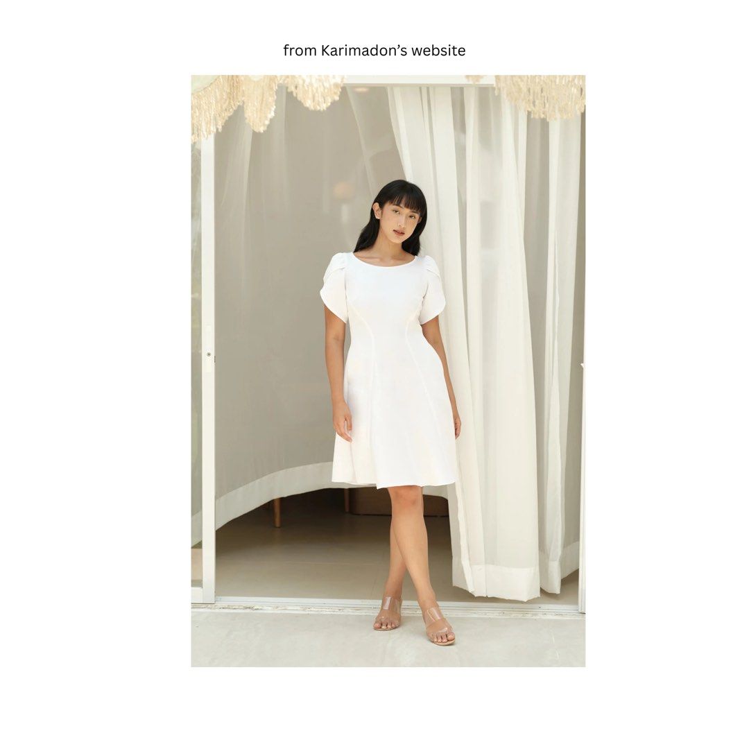 Karimadon Penelope Dress (Category: Dresses) located in Candaba. Submitted by prettyandclean (Listing ID 1460587996, Image 2). Description: - Worn once :) - Size is Small - White dress from Karimadon - Features puff sleeves - Note: Photos may show slight yellowing due to lighting. Actual color is white. - Feel free to message for more pictures!.