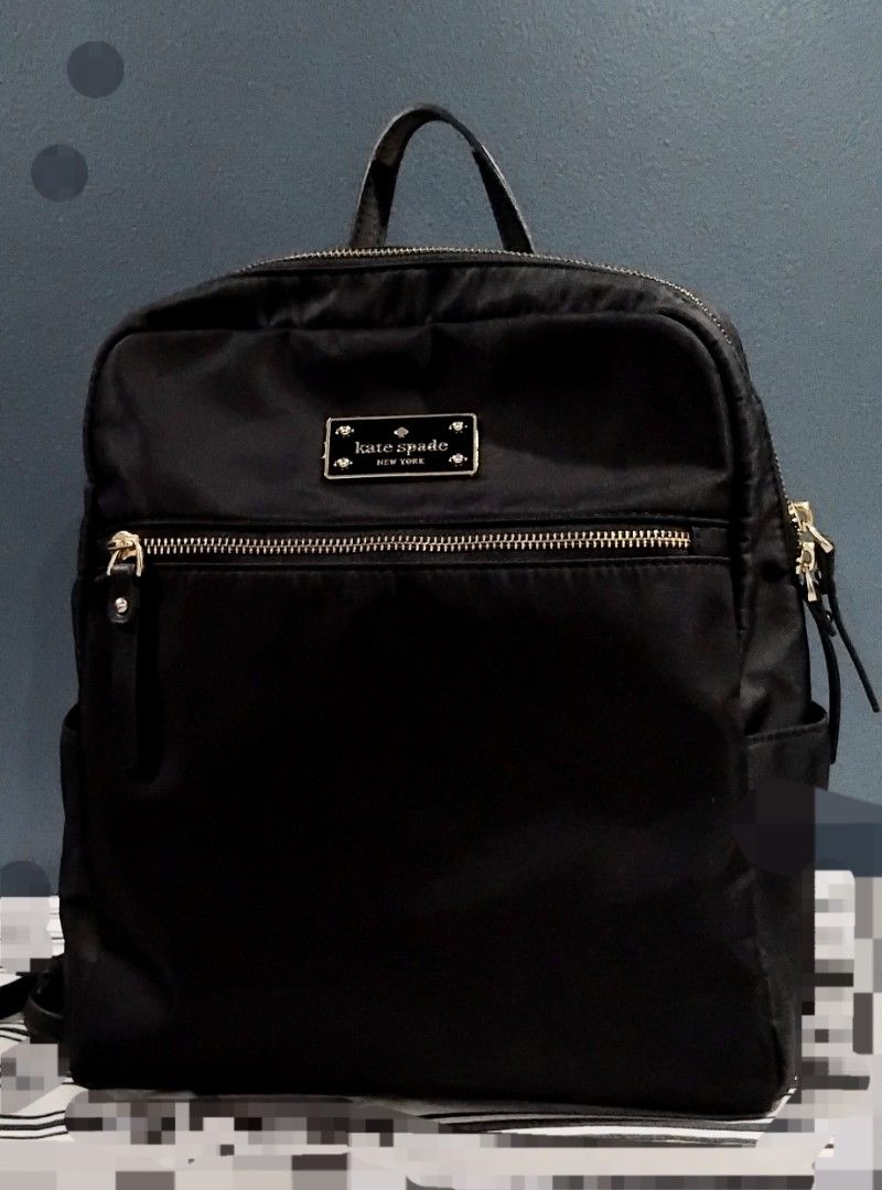 Kate spade backpack (Category: Backpacks) located in Manila. Submitted by sel1nan3k0 (Listing ID 1460208357, Image 1). Description: selling this Kate Spade bag. original. color: black. outer nylon fabric is still excellent. inner fabric still in very good condition. no problem with zippers. *some leather parts are peeling, due to humidity and storage in the cabinet. php 1300 loc: alabang gcash+ sf dm to inquire..