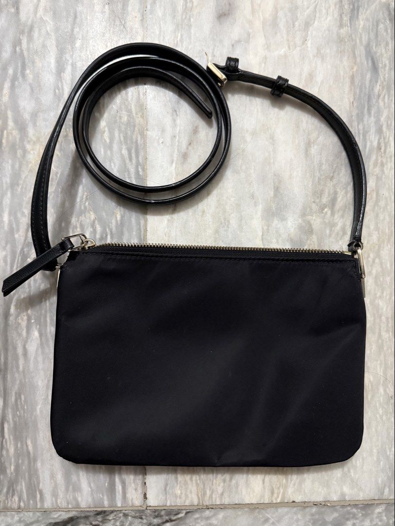 Kate Spade Black Crossbody Bag (Category: Cross-body Bags) located in San Mateo. Submitted by aifoslvdr (Listing ID 1460643274, Image 3). Description: Black Kate Spade crossbody bag - Zip closure for security - Long strap for shoulder or crossbody wear - Made with durable nylon - Multiple compartments for organization - Authentic Kate Spade logo detail.