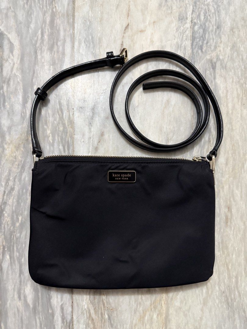 Kate Spade Black Crossbody Bag (Category: Cross-body Bags) located in San Mateo. Submitted by aifoslvdr (Listing ID 1460643274, Image 1). Description: Black Kate Spade crossbody bag - Zip closure for security - Long strap for shoulder or crossbody wear - Made with durable nylon - Multiple compartments for organization - Authentic Kate Spade logo detail.