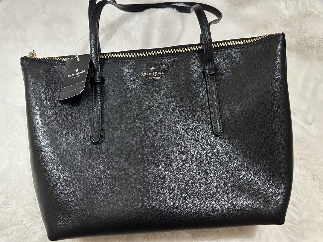 Kate Spade KO140 Black All Day Tote (Category: Tote Bags) located in Cebu City. Submitted by nadinelle (Listing ID 1460515613, Image 1). Description: - Classic black leather tote bag - Brand: Kate Spade - Gold hardware - Zip closure - Interior zip pocket - Spacious main compartment - Ideal for work or everyday use.