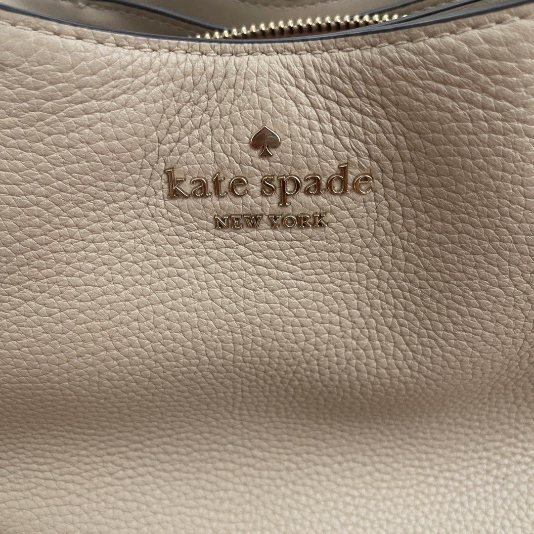 Kate Spade SMALL Dumpling Light Sand; Pebble Leather Bag (Category: Luxury Bags & Wallets) located in Makati City. Submitted by marie.tan (Listing ID 1460567991, Image 3). Description: - Light beige Kate Spade satchel bag - Crafted from durable pebble leather - Versatile with top handles and a detachable crossbody strap - Interior zip pocket for secure storage - Elegant gold hardware - Comes with original tag.