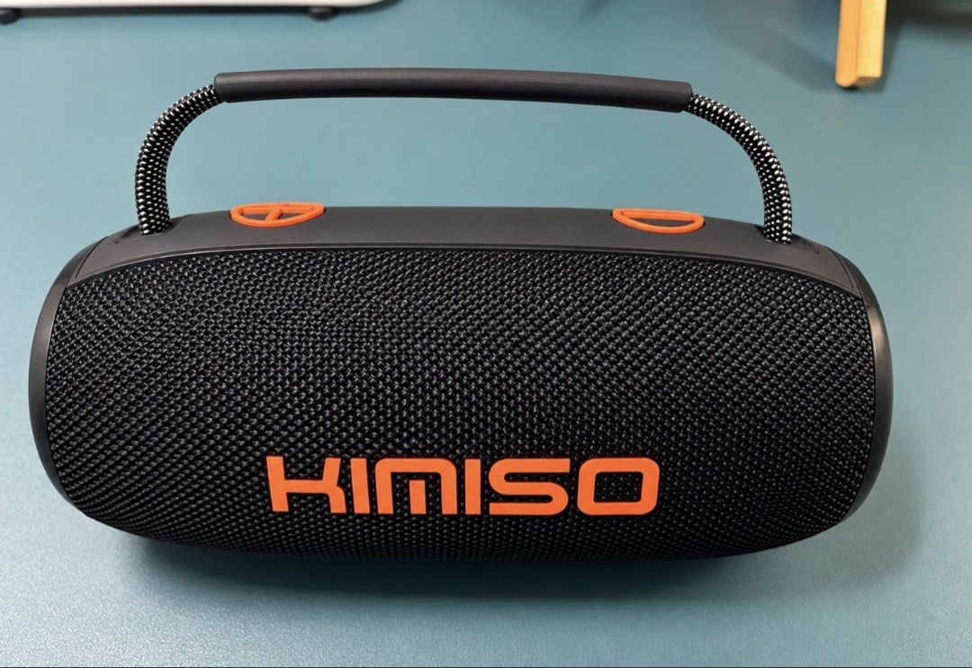 KIMISO Portable Bluetooth Speaker with Handle (Category: Soundbars, Speakers & Amplifiers) located in Makati City. Submitted by nanayjen (Listing ID 1460510035, Image 1). Description: - Portable KIMISO speaker - Color: Black with orange accents - Features a sturdy handle for easy carrying - Wireless Bluetooth connectivity - Simple controls located on top - Delivers good sound quality for its size - Perfect for music on the go - Regular type c cha