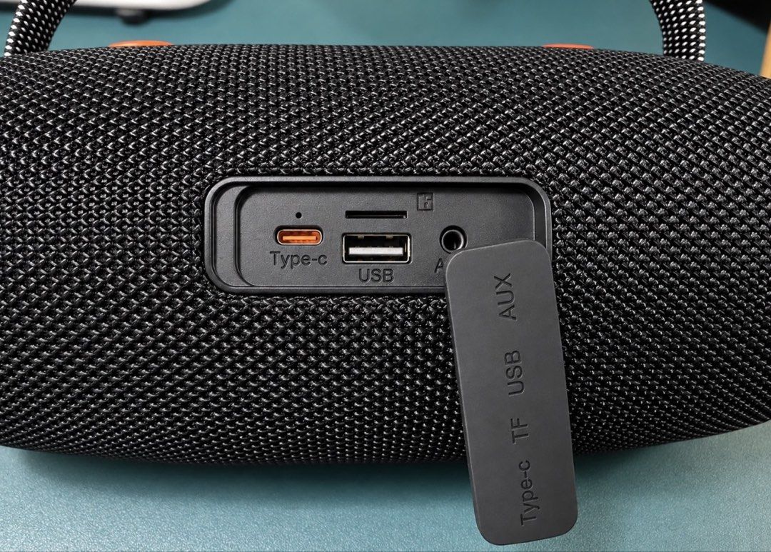 KIMISO Portable Bluetooth Speaker with Handle (Category: Soundbars, Speakers & Amplifiers) located in Makati City. Submitted by nanayjen (Listing ID 1460510035, Image 3). Description: - Portable KIMISO speaker - Color: Black with orange accents - Features a sturdy handle for easy carrying - Wireless Bluetooth connectivity - Simple controls located on top - Delivers good sound quality for its size - Perfect for music on the go - Regular type c cha