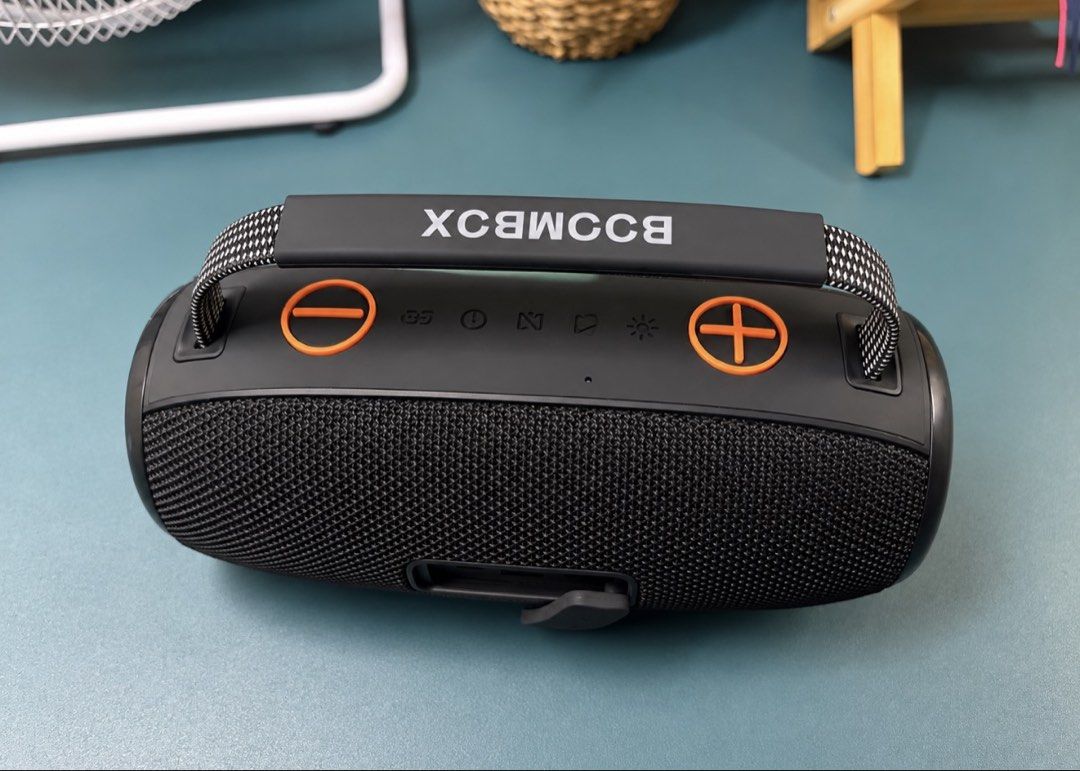 KIMISO Portable Bluetooth Speaker with Handle (Category: Soundbars, Speakers & Amplifiers) located in Makati City. Submitted by nanayjen (Listing ID 1460510035, Image 2). Description: - Portable KIMISO speaker - Color: Black with orange accents - Features a sturdy handle for easy carrying - Wireless Bluetooth connectivity - Simple controls located on top - Delivers good sound quality for its size - Perfect for music on the go - Regular type c cha