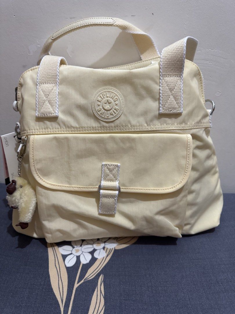 Kipling 2way bag (Category: Announcements) located in Quezon City. Submitted by branded_jo (Listing ID 1460623219, Image 2). Description: Original kipling 2way bag Med size Color light yellow Brand new with tag Bought in US Lalamove ready.