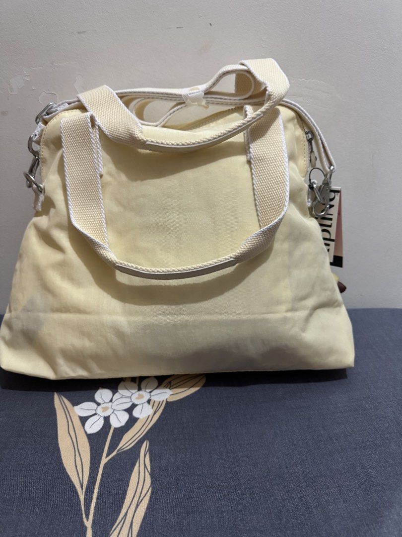 Kipling 2way bag (Category: Announcements) located in Quezon City. Submitted by branded_jo (Listing ID 1460623219, Image 3). Description: Original kipling 2way bag Med size Color light yellow Brand new with tag Bought in US Lalamove ready.