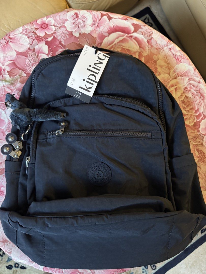 Kipling Back Pack (Category: Shoulder Bags) located in Singapore. Submitted by aeroavanti (Listing ID 1460575469, Image 4). Description: Dark Blue Kipling back pack for ladies. Brand New and still in original packing bought from Amazon at $90.00. In good condition not damage and all zippers working..