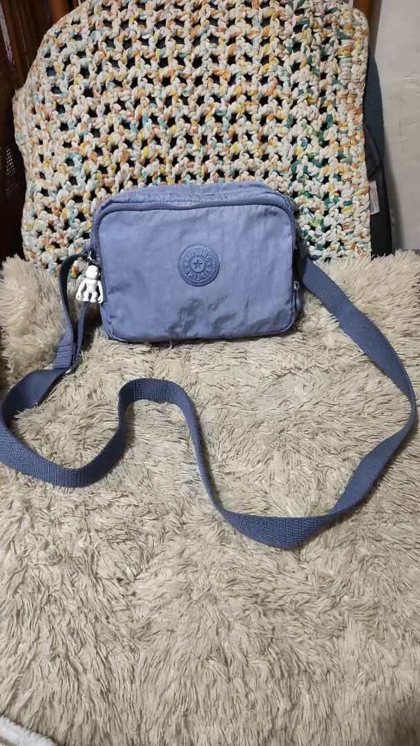 Kipling Blue Nylon Crossbody Bag with Monkey Charm (Category: Cross-body Bags) located in Cebu City. Submitted by lumaynojes00490 (Listing ID 1460535165, Image 3). Description: - Blue Kipling crossbody bag - Durable nylon material - Secure zipper closure - Adjustable strap for comfort - Comes with the iconic Kipling monkey charm - Ideal for everyday use and travel - Spacious interior for your essentials.
