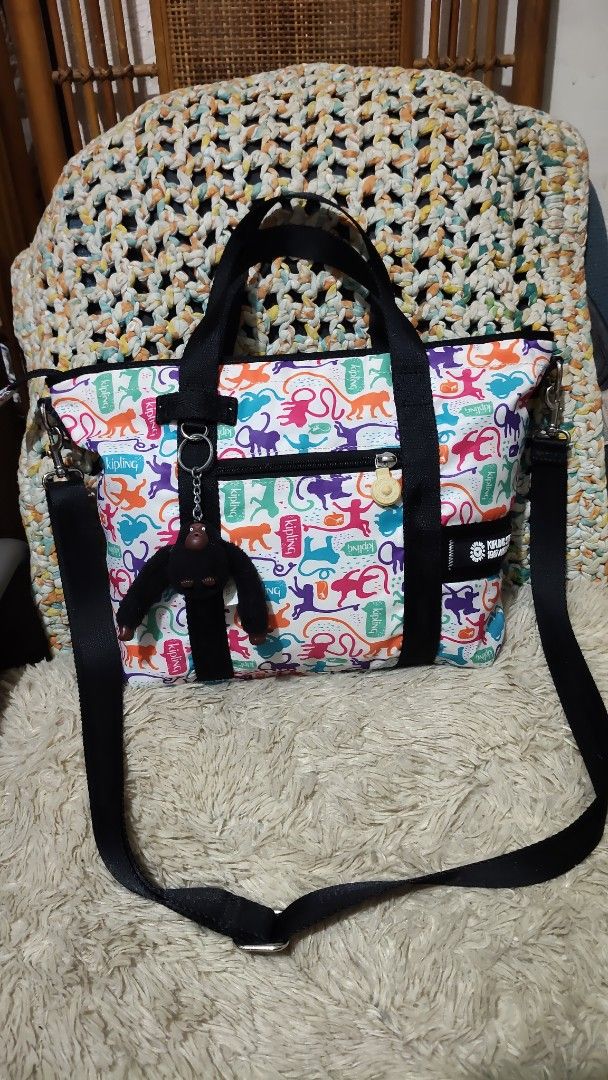Kipling Tote Bag Monkey Print (Category: Tote Bags) located in Cebu City. Submitted by lumaynojes00490 (Listing ID 1460534125, Image 3). Description: - Adorable Kipling tote bag - Fun all-over monkey print - Black handles - Detachable shoulder strap included - Zippered main compartment for security - Convenient front pockets - Signature Kipling monkey charm - Ideal for everyday errands and activities.