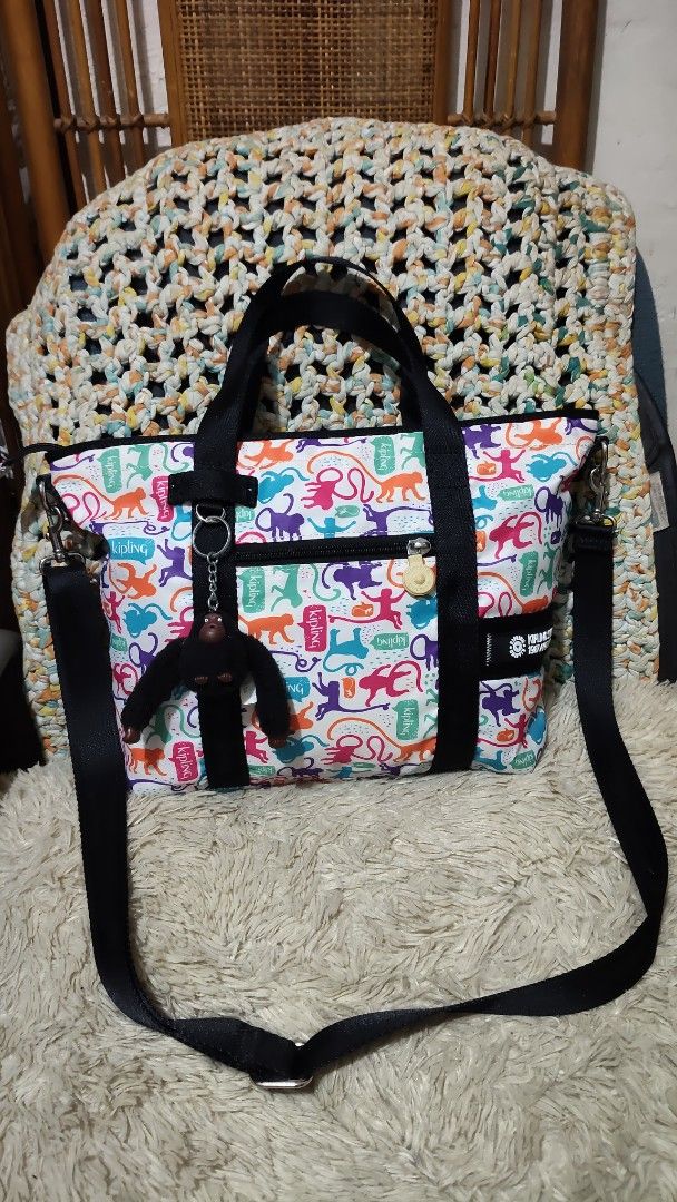 Kipling Tote Bag Monkey Print (Category: Tote Bags) located in Cebu City. Submitted by lumaynojes00490 (Listing ID 1460534125, Image 2). Description: - Adorable Kipling tote bag - Fun all-over monkey print - Black handles - Detachable shoulder strap included - Zippered main compartment for security - Convenient front pockets - Signature Kipling monkey charm - Ideal for everyday errands and activities.