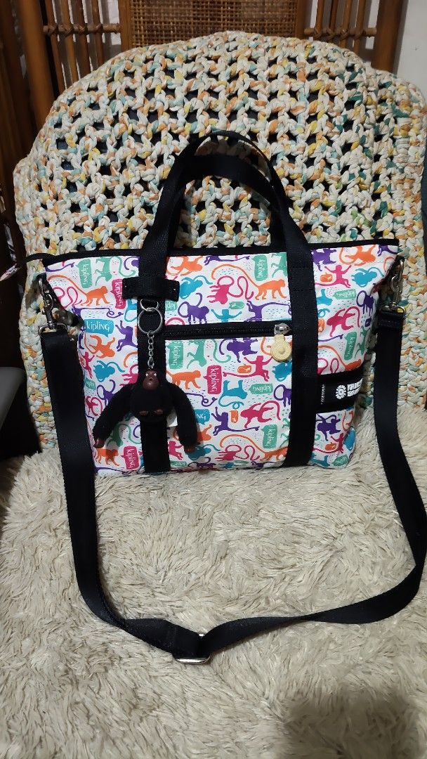 Kipling Tote Bag Monkey Print (Category: Tote Bags) located in Cebu City. Submitted by lumaynojes00490 (Listing ID 1460534125, Image 1). Description: - Adorable Kipling tote bag - Fun all-over monkey print - Black handles - Detachable shoulder strap included - Zippered main compartment for security - Convenient front pockets - Signature Kipling monkey charm - Ideal for everyday errands and activities.