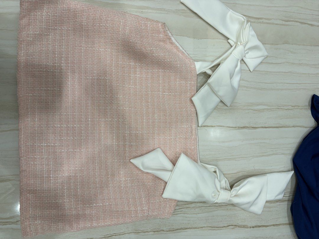 La Coco Babe Pink Tweed Top with White [Last Price Posted] (Category: Sleeveless) located in Pasig City. Submitted by luxurypreloved12 (Listing ID 1460576260, Image 2). Description: - Pink tweed top from La Coco Babe - Features cute white bows on the shoulders - Square neckline - Pairs well with jeans or skirts - Perfect for a chic, feminine, and stylish look - Comfortable for any occasion - Minor Stains as seen in pics above No LP lowballers or 