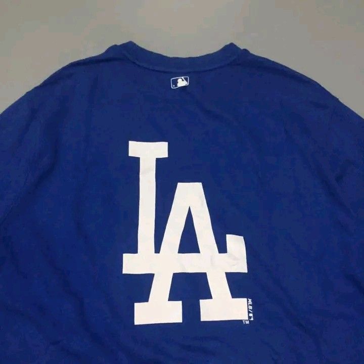 LA Dodgers MLB Blue Crewneck Sweatshirt (Category: Coats, Jackets and Outerwear) located in Calbayog City. Submitted by taking-candy.ph (Listing ID 1460656576, Image 3). Description: - Official MLB merchandise - Blue crewneck sweatshirt - Iconic LA Dodgers 'LA' logo on front and back - Comfortable and stylish for everyday wear - Perfect for casual outings and Dodgers fans.