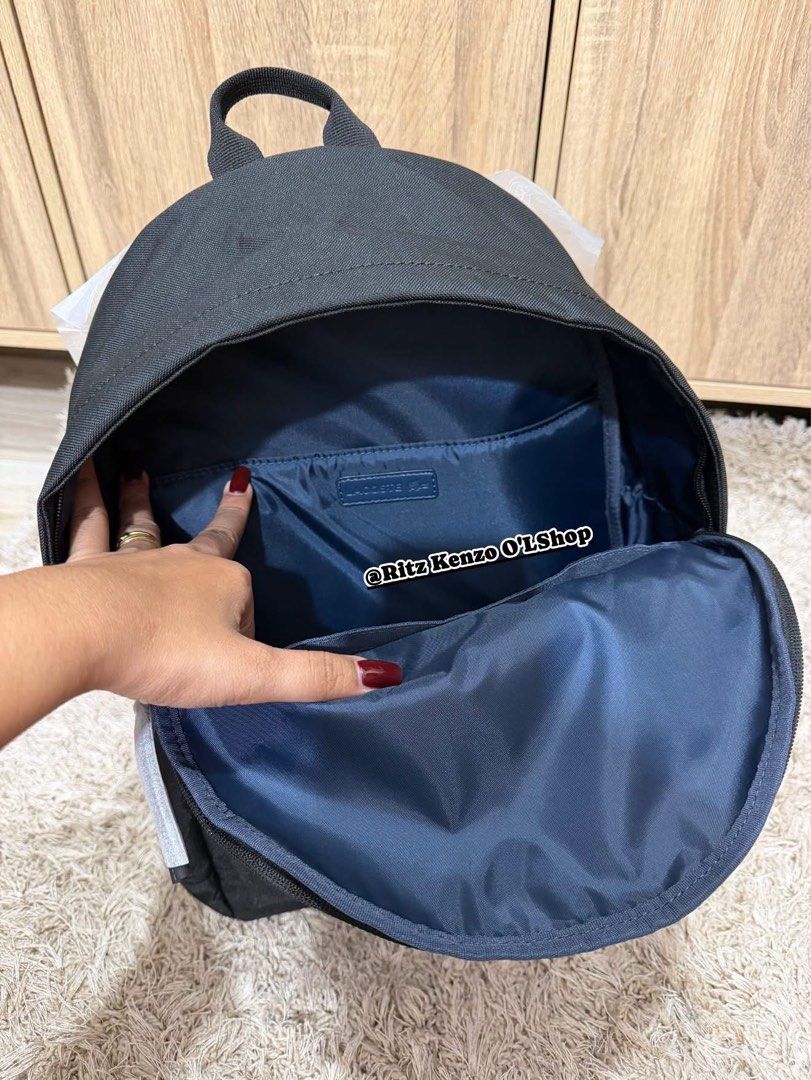 Lacoste Backpack Black Polyester CANS126 (Category: Backpacks) located in Antipolo. Submitted by ritzkenzo_olshop06 (Listing ID 1460538434, Image 3). Description: - Authentic Black Lacoste Backpack - Durable Polyester Material - Zippered Front Pocket for easy access - Spacious Main Compartment with Interior Sleeve - Navy Blue Interior Lining - Brand New with Tags Attached - Ideal for Everyday Use.
