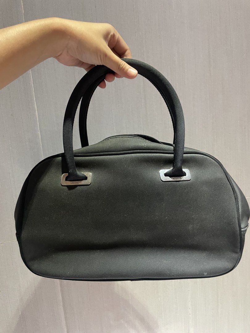 Lacoste Black Bowling Bag (Category: Tote Bags) located in Iligan City. Submitted by lisiantbel (Listing ID 1460659662, Image 2). Description: - Authentic Black Lacoste Boston Bag - Durable Canvas Material - Zippered Main Compartment - Internal Pockets for Organization - Dual Top Handles for Easy Carrying - Iconic Embossed Lacoste Crocodile Logo on Front - Ideal for Everyday Use.