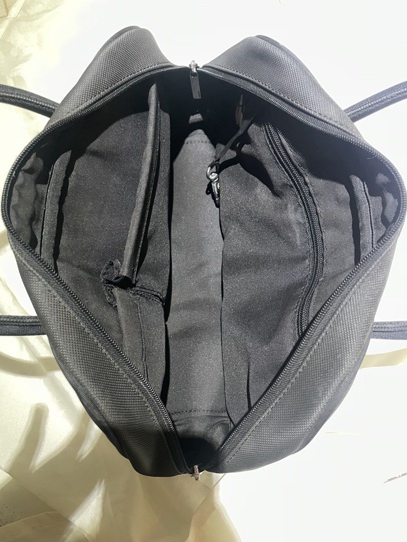 Lacoste Black Bowling Bag (Category: Tote Bags) located in Iligan City. Submitted by lisiantbel (Listing ID 1460659662, Image 3). Description: - Authentic Black Lacoste Boston Bag - Durable Canvas Material - Zippered Main Compartment - Internal Pockets for Organization - Dual Top Handles for Easy Carrying - Iconic Embossed Lacoste Crocodile Logo on Front - Ideal for Everyday Use.