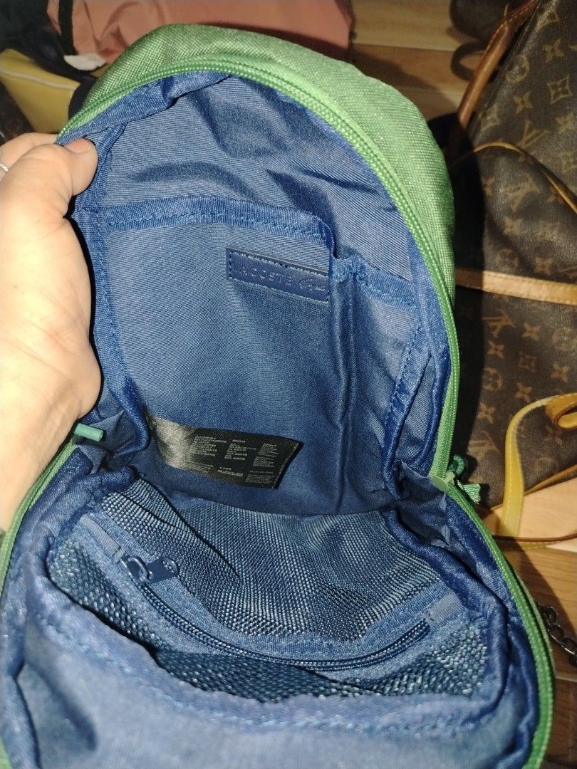 Lacoste body bag (Category: Cross-body Bags) located in Tagum. Submitted by mjprelovedbags2020 (Listing ID 1460509323, Image 2). Description: Like new orig lacoste body bag medium size emaerald green unisex.