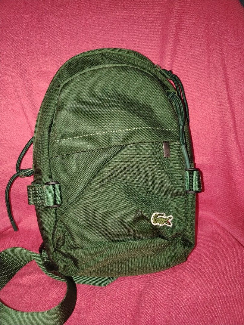 Lacoste body bag (Category: Cross-body Bags) located in Tagum. Submitted by mjprelovedbags2020 (Listing ID 1460509323, Image 1). Description: Like new orig lacoste body bag medium size emaerald green unisex.