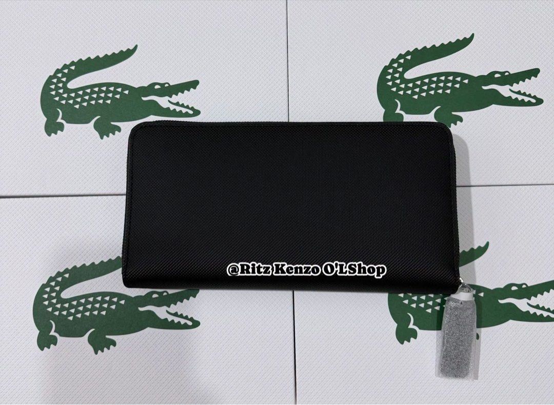 Lacoste Noir L Zip Wallet Polyvinyl Chloride (Category: Wallets & Card Holders) located in Antipolo. Submitted by ritzkenzo_olshop06 (Listing ID 1460538799, Image 2). Description: - Authentic Lacoste wallet in black - Model NF4776OV - Secure zip-around closure - Ample card slots and compartments for organization - Durable polyvinyl chloride (PVC) material - Comes with original tag.