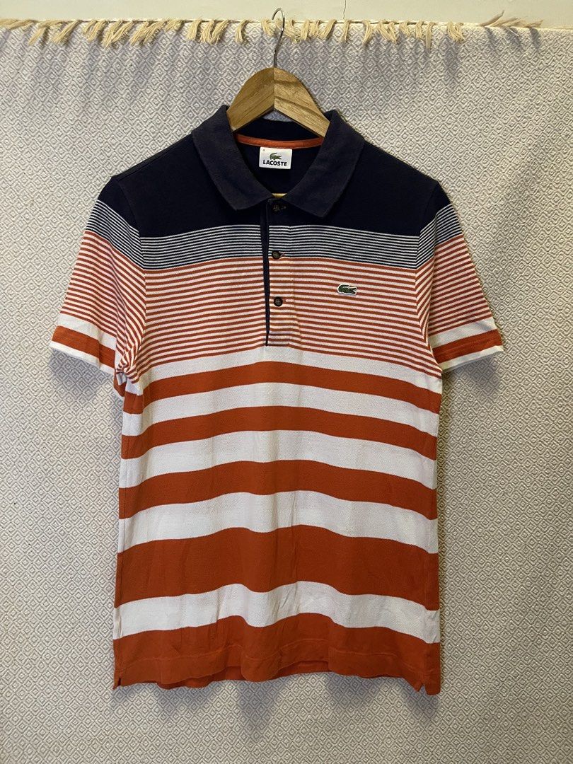 Lacoste orrange stripe polo shirt (Category: Tshirts & Polo Shirts ) located in Manila. Submitted by hypestock_mnl (Listing ID 1460564893, Image 1). Description: - stylish - perfect for casual wear - great fit - in good condition - minimal signs of usage - 9/10 - money worth! - see pics for details/issue.
