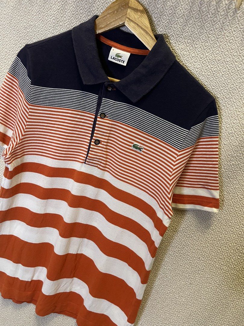Lacoste orrange stripe polo shirt (Category: Tshirts & Polo Shirts ) located in Manila. Submitted by hypestock_mnl (Listing ID 1460564893, Image 2). Description: - stylish - perfect for casual wear - great fit - in good condition - minimal signs of usage - 9/10 - money worth! - see pics for details/issue.