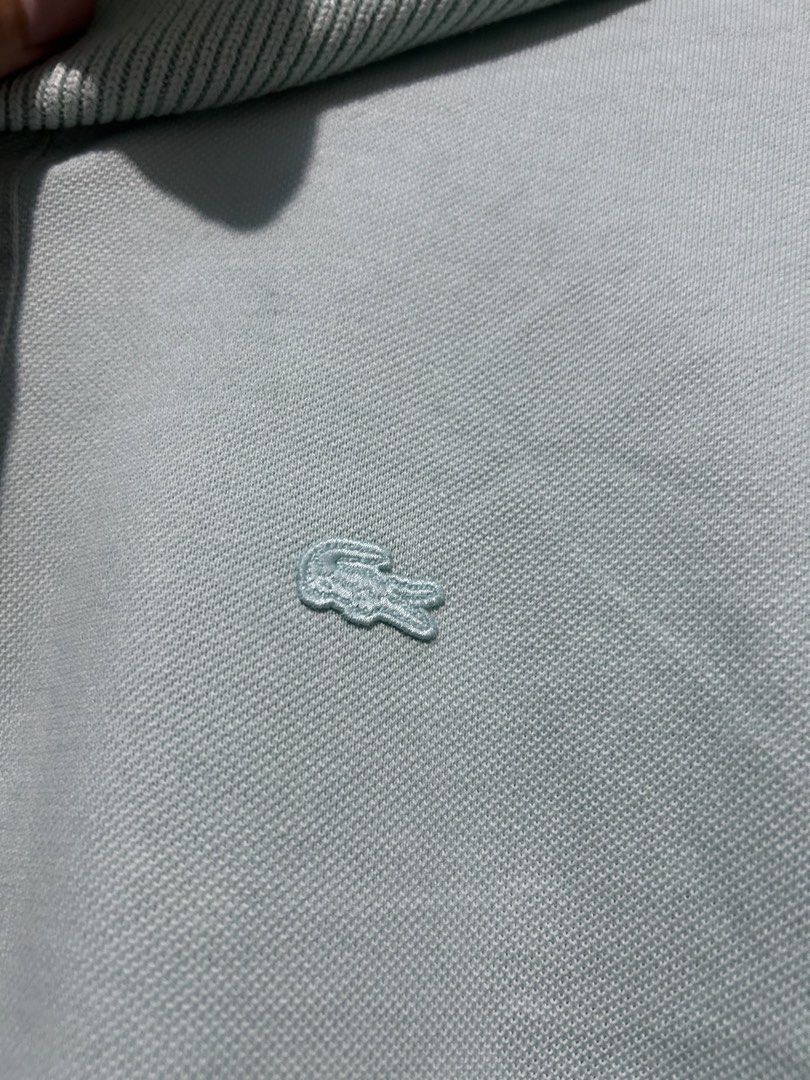 Lacoste Polo Shirt Light Blue Size 34 (Category: Others Tops) located in Barotac Nuevo. Submitted by ehsherjohn27 (Listing ID 1460555704, Image 2). Description: - Light blue Lacoste polo shirt - Iconic crocodile logo - Ribbed collar and cuffs - Two-button placket - Size 34 - Made in China - Ideal for casual wear.
