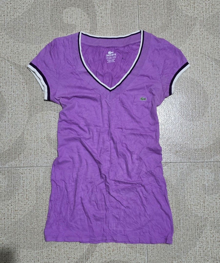 Lacoste Purple V Neck Tshirt (Category: Shirts) located in El Nido. Submitted by marco.tandoc (Listing ID 1460572677, Image 1). Description: size: 34 fit (xsmall to small) width: 14 length: 25 no issue.