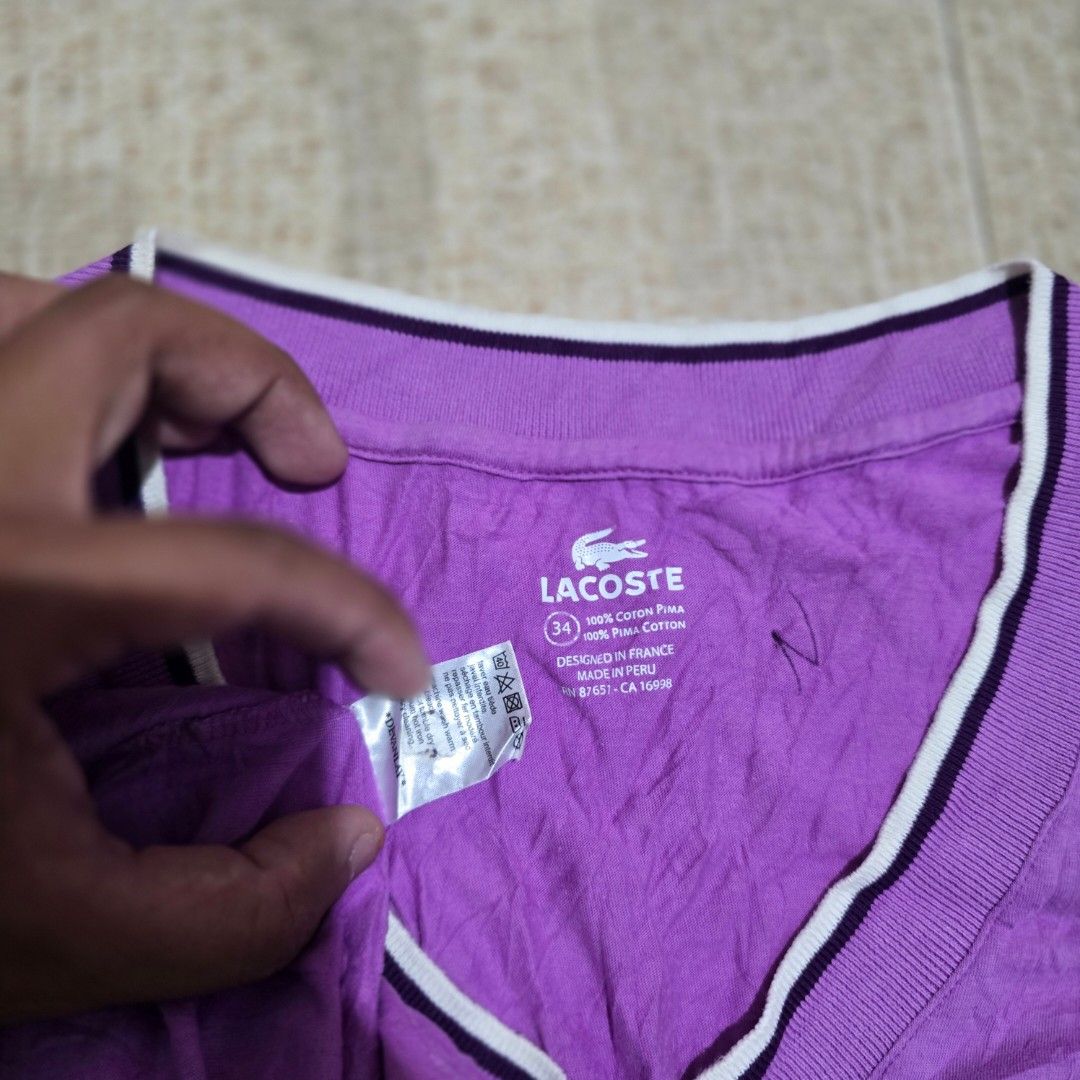 Lacoste Purple V Neck Tshirt (Category: Shirts) located in El Nido. Submitted by marco.tandoc (Listing ID 1460572677, Image 3). Description: size: 34 fit (xsmall to small) width: 14 length: 25 no issue.