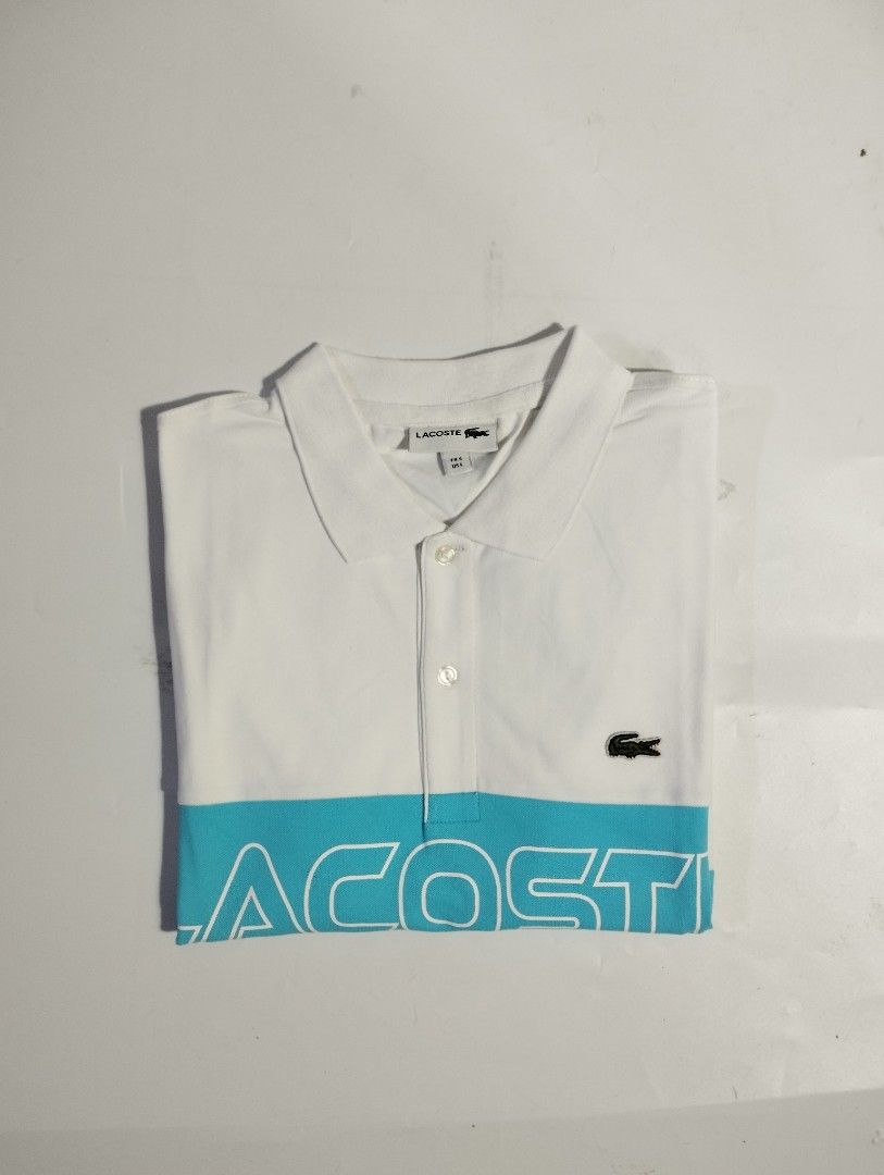 LACOSTE WHITE POLO SHIRT (Category: Activewear) located in Manila. Submitted by apparell (Listing ID 1460526363, Image 1). Description: LACOSTE WHITE POLO SHIRT BRAND NEW AUTHENTIC NO ISSUE COMPLETE TAGS 10/10 SIZE L 22X28.