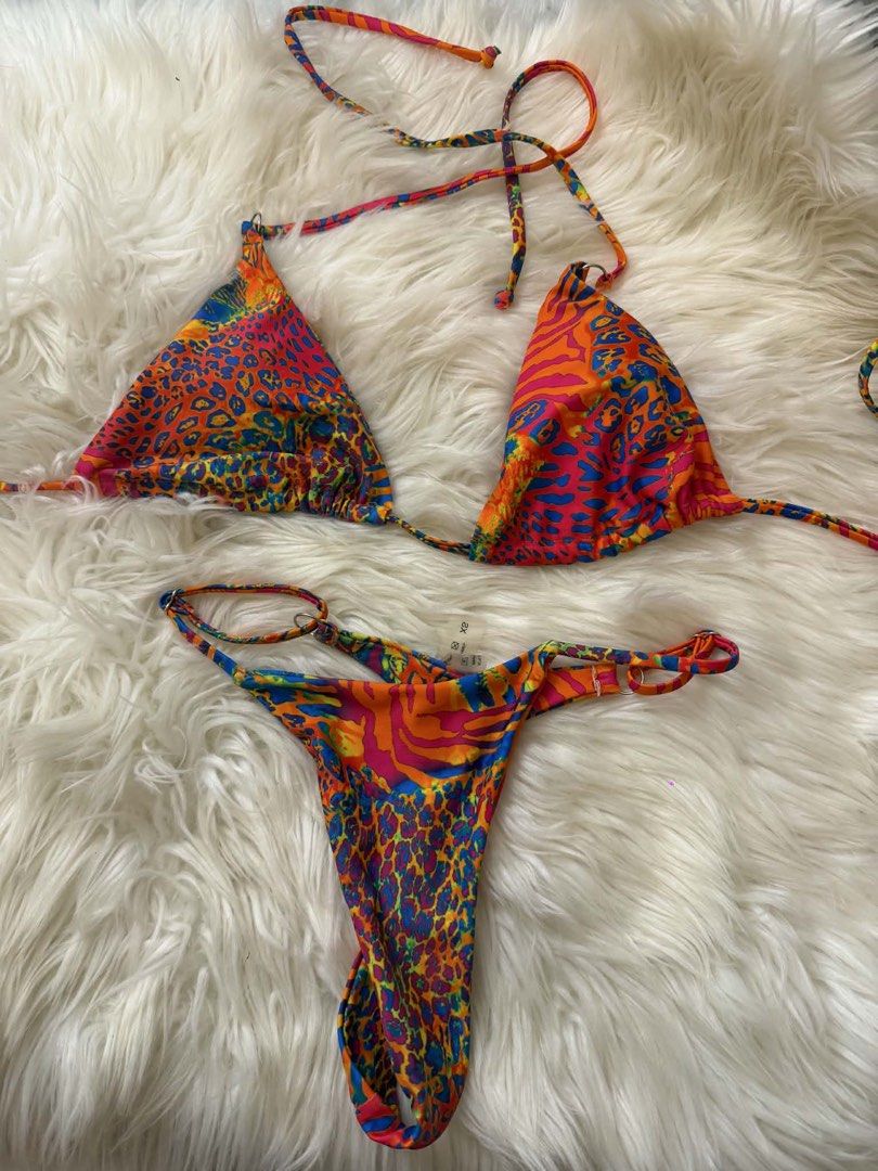 leopard Print Triangle Bikini Set (Category: Bikinis & Swimsuits) located in Bacoor. Submitted by hazimist (Listing ID 1460517114, Image 1). Description: - Fun and colorful bikini set - Features a bold animal and abstract print - Triangle top with adjustable tie straps - Matching thong bottoms with tie sides - Perfect for the beach or pool - Stand out with this unique design.