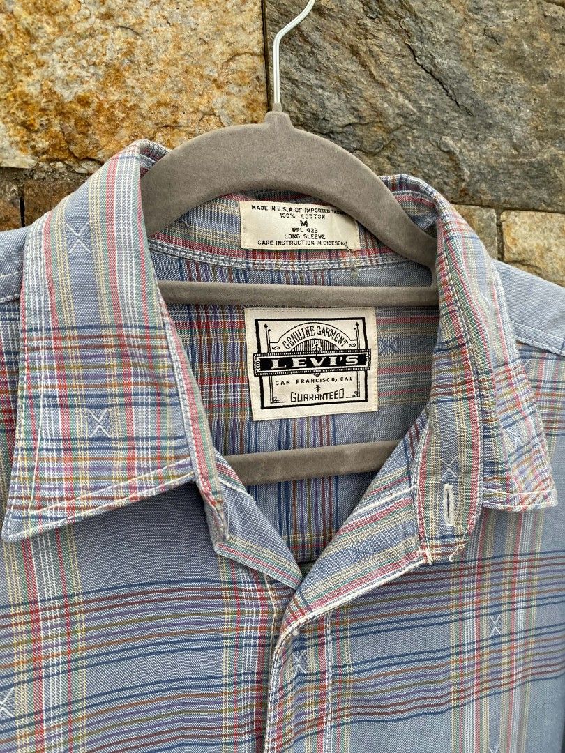 LEVIS Vintage 90s Plaid Long sleeve (Category: Activewear) located in Manila. Submitted by asiongmx (Listing ID 1460587176, Image 3). Description: LEVIS Vintage 90s Plaid Long sleeve Made in USA Original Size M on tag Can be fit to L Personal item A collector's item Excellent condition Quezon City Area Decluttering.