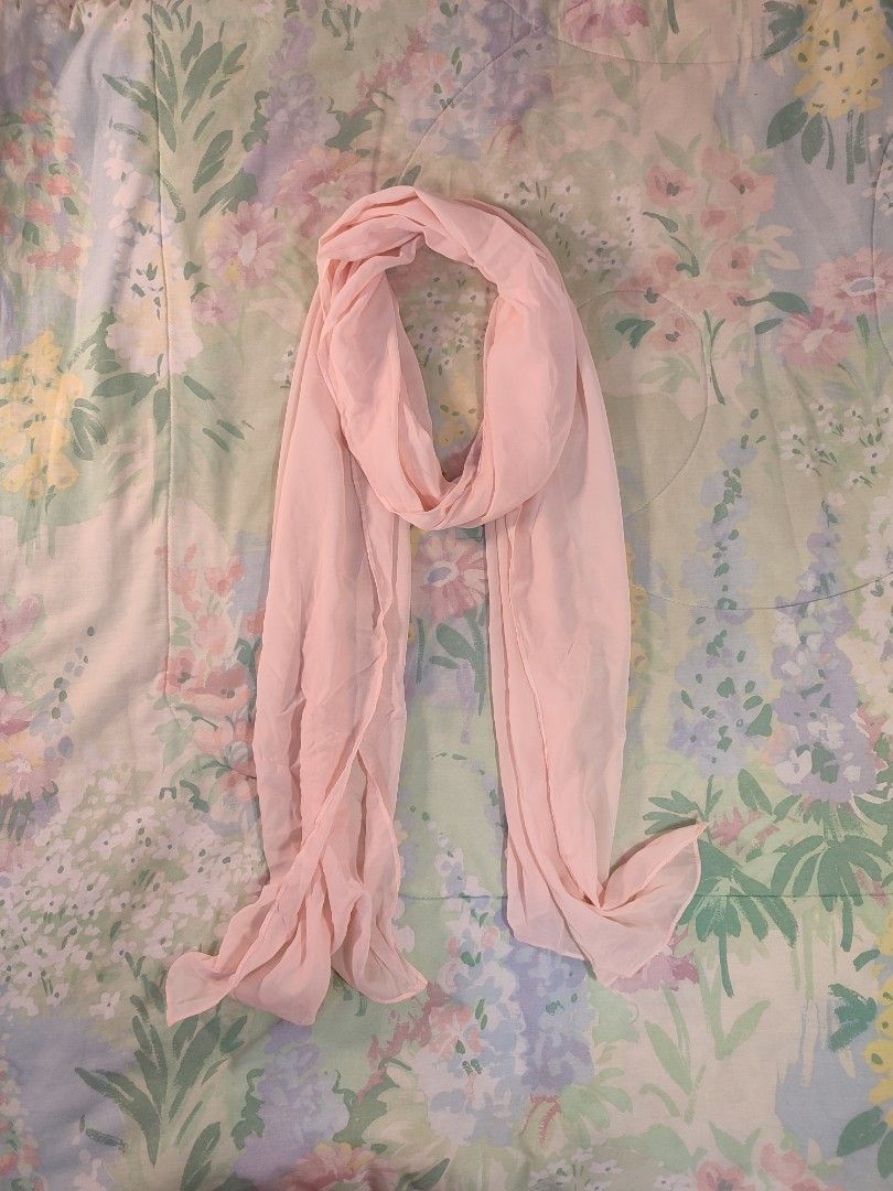 Light Pink Sheer Scarf (Category: Scarves) located in Jaen. Submitted by roxantiago (Listing ID 1460641893, Image 1). Description: - Light pink sheer scarf - Soft and flowy material - Perfect for adding a pop of color - Small stain on one end (visible in last photo) 17" by 92".