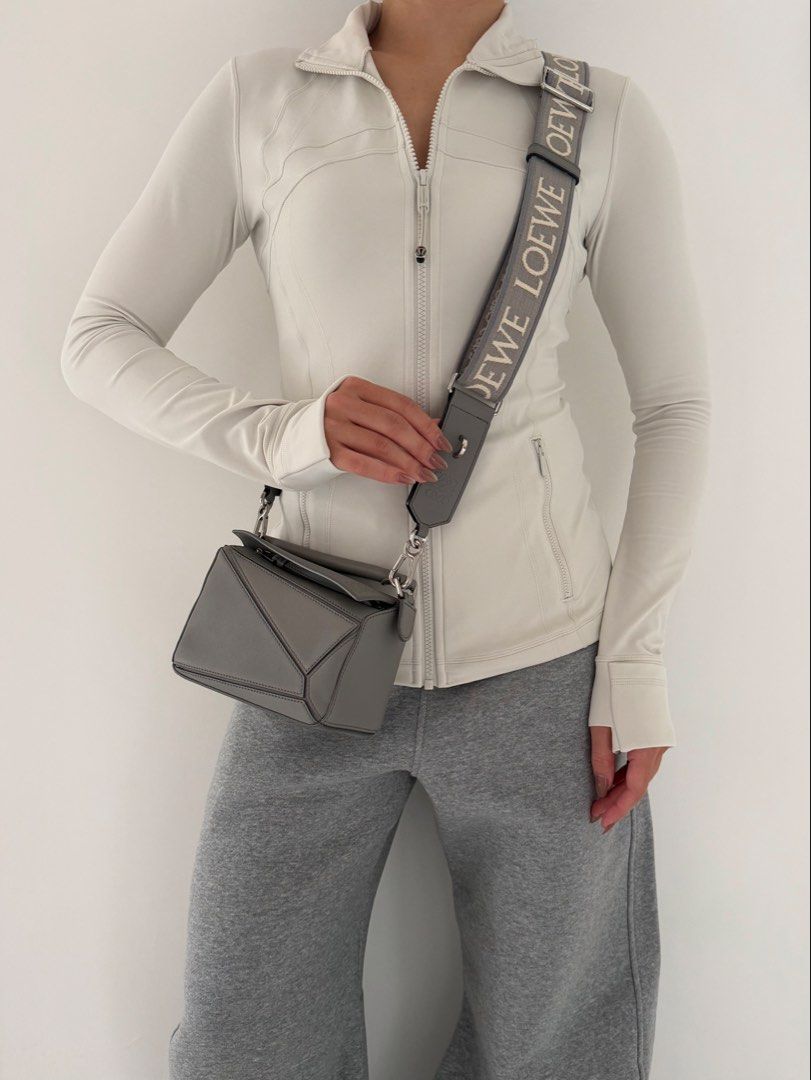 Loewe Puzzle Mini in Pearl Grey (Category: Luxury Bags & Wallets) located in Quezon City. Submitted by lian_closet (Listing ID 1460694556, Image 2). Description: Loewe Puzzle Mini in Pearl Grey Best Price: ₱90,000 Preloved Comes with Two Straps, Free Bag Organizer, Copy of Receipt, Dust Bag & LegitGrails Authenticity Certificate .