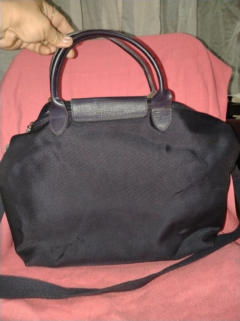 Long champ orig (Category: Shoulder Bags) located in Tagum. Submitted by mjprelovedbags2020 (Listing ID 1460509868, Image 2). Description: With minimal sign of use orig po kaya murang mura na malaki po siya for travel and office bag 2 way na po violet actual color.