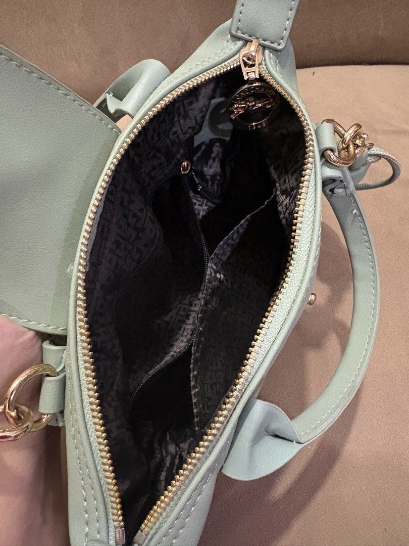 Longchamp Le Pliage Cuir Mini Top Handle Bag (Category: Luxury Bags & Wallets) located in Muntinlupa City. Submitted by xiannahailey (Listing ID 1460579215, Image 3). Description: - Light blue Longchamp mini top handle bag - Genuine leather material - Detachable shoulder strap included - Main zippered compartment with interior pockets - Adorable beaded charms - Versatile for everyday or special events.