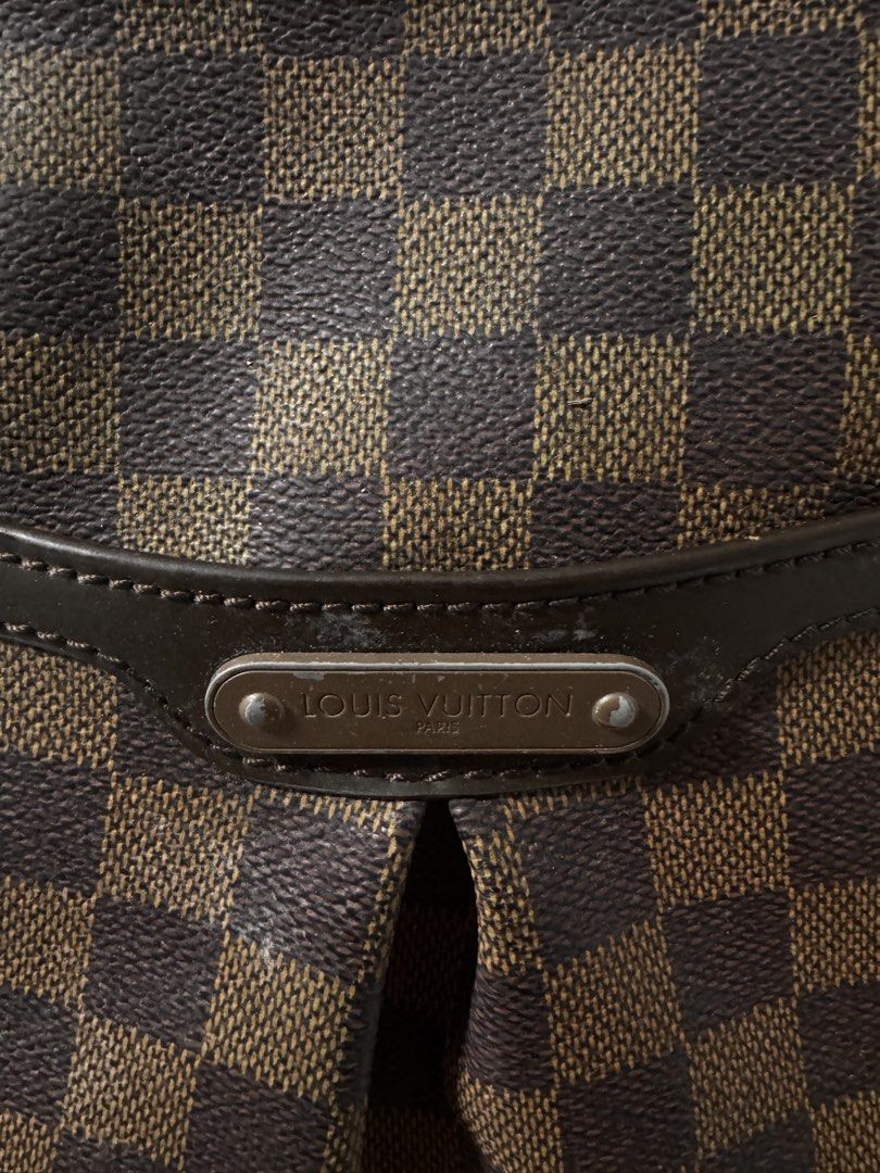 Louis Vuitton Damier Canvas Shoulder Bag (Category: Luxury Bags & Wallets) located in Cavite. Submitted by aldrindela40142 (Listing ID 1460580338, Image 3). Description: - Louis Vuitton shoulder bag - Damier Ebene canvas with classic checkered pattern - Genuine leather trim and strap - Gold-tone hardware - Secure zipper closure - Perfect for everyday use - Shows minor signs of wear on strap and hardware, consistent with normal use.