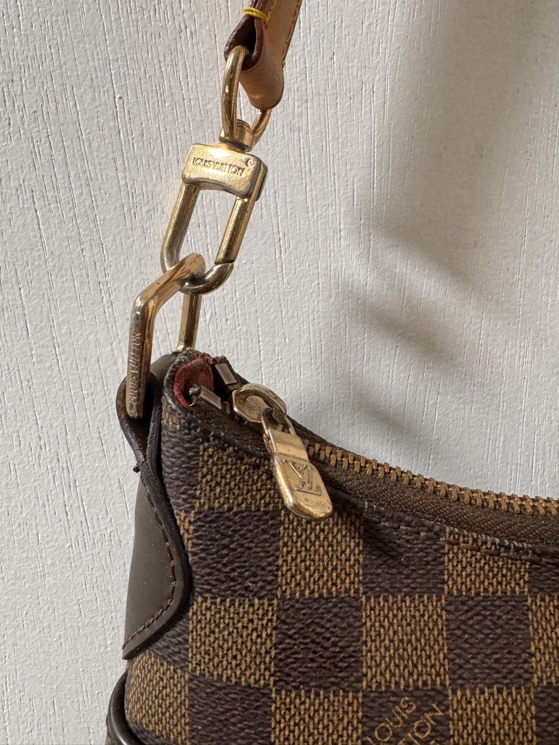Louis Vuitton Damier Canvas Shoulder Bag (Category: Luxury Bags & Wallets) located in Cavite. Submitted by aldrindela40142 (Listing ID 1460580338, Image 2). Description: - Louis Vuitton shoulder bag - Damier Ebene canvas with classic checkered pattern - Genuine leather trim and strap - Gold-tone hardware - Secure zipper closure - Perfect for everyday use - Shows minor signs of wear on strap and hardware, consistent with normal use.