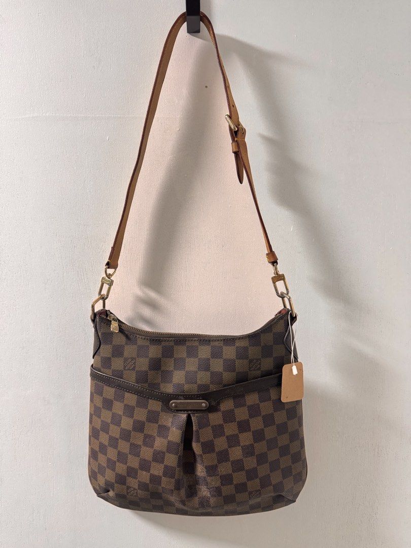 Louis Vuitton Damier Canvas Shoulder Bag (Category: Luxury Bags & Wallets) located in Cavite. Submitted by aldrindela40142 (Listing ID 1460580338, Image 1). Description: - Louis Vuitton shoulder bag - Damier Ebene canvas with classic checkered pattern - Genuine leather trim and strap - Gold-tone hardware - Secure zipper closure - Perfect for everyday use - Shows minor signs of wear on strap and hardware, consistent with normal use.