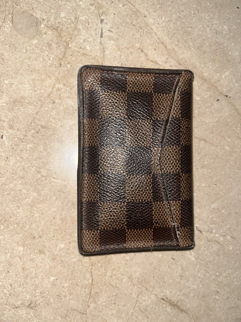 Louis Vuitton Damier Ebene Card Holder (Category: Luxury Bags & Wallets) located in Makati City. Submitted by aliyahprieto949 (Listing ID 1460630089, Image 1). Description: - Authentic Louis Vuitton card holder - Classic Damier Ebene canvas - Slim and pocket-friendly design - Shows some signs of wear on edges/corners - Plenty of life left, great for card organization.