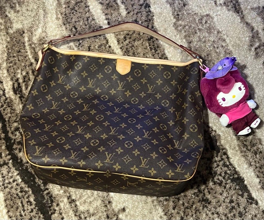 Louis Vuitton Monogram Shoulder Bag (Category: Luxury Bags & Wallets) located in Manila. Submitted by supermom888 (Listing ID 1460516992, Image 1). Description: - Classic Louis Vuitton monogram shoulder bag - Spacious interior - Comes with a Kitty charm - Perfect for everyday luxury.
