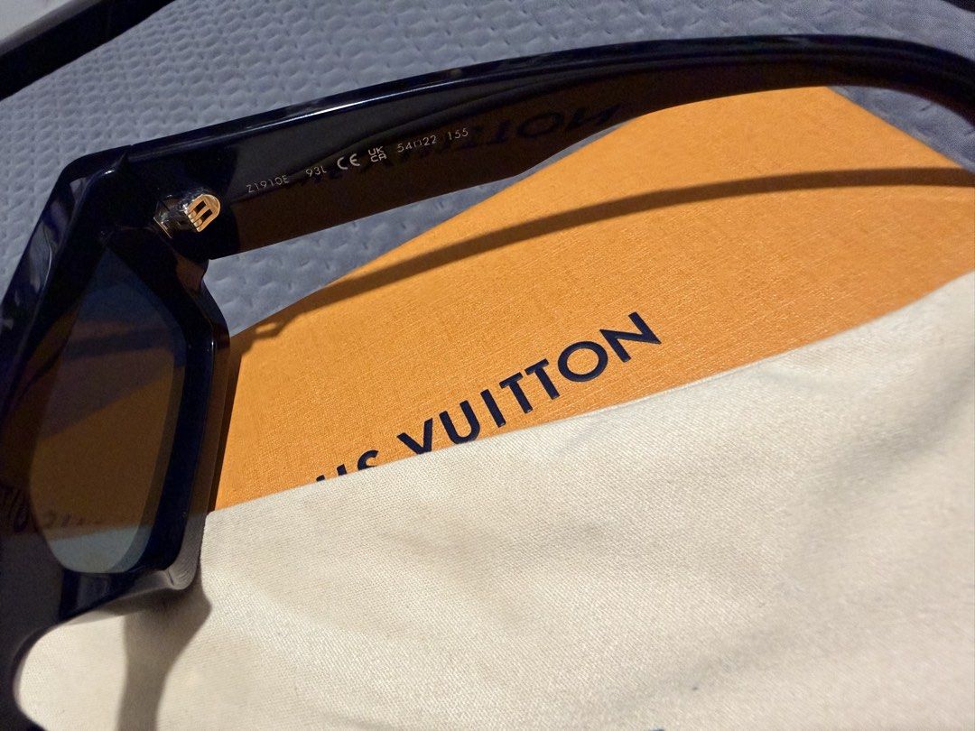 Louis Vuitton Sunglasses with Box and Pouch (Category: Sunglasses & Eyewear) located in Bulacan. Submitted by denz527 (Listing ID 1460698525, Image 3). Description: - Authentic Louis Vuitton Sunglasses - Classic Black Frame - Includes Original Orange Box, Blue Case, and Soft Pouch - Ideal for Sunny Weather Bought at LV Solaire.