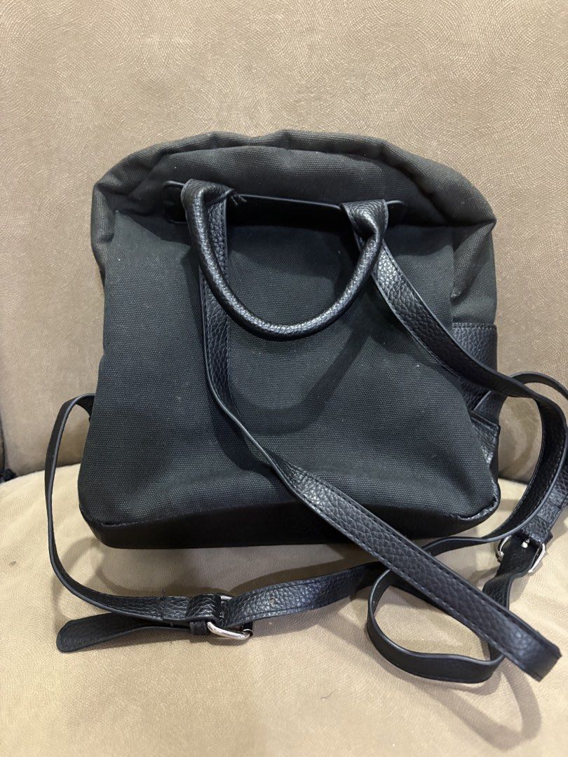 LOVE MOSCHINO Black Canvas Heart Backpack (Category: Backpacks) located in Muntinlupa City. Submitted by xiannahailey (Listing ID 1460577933, Image 2). Description: - Brand: LOVE MOSCHINO - Color: Black - Material: Canvas - Design: Iconic red heart detail on the front - Features: Adjustable straps, interior pocket - Ideal for: Everyday use, stylish accessory.
