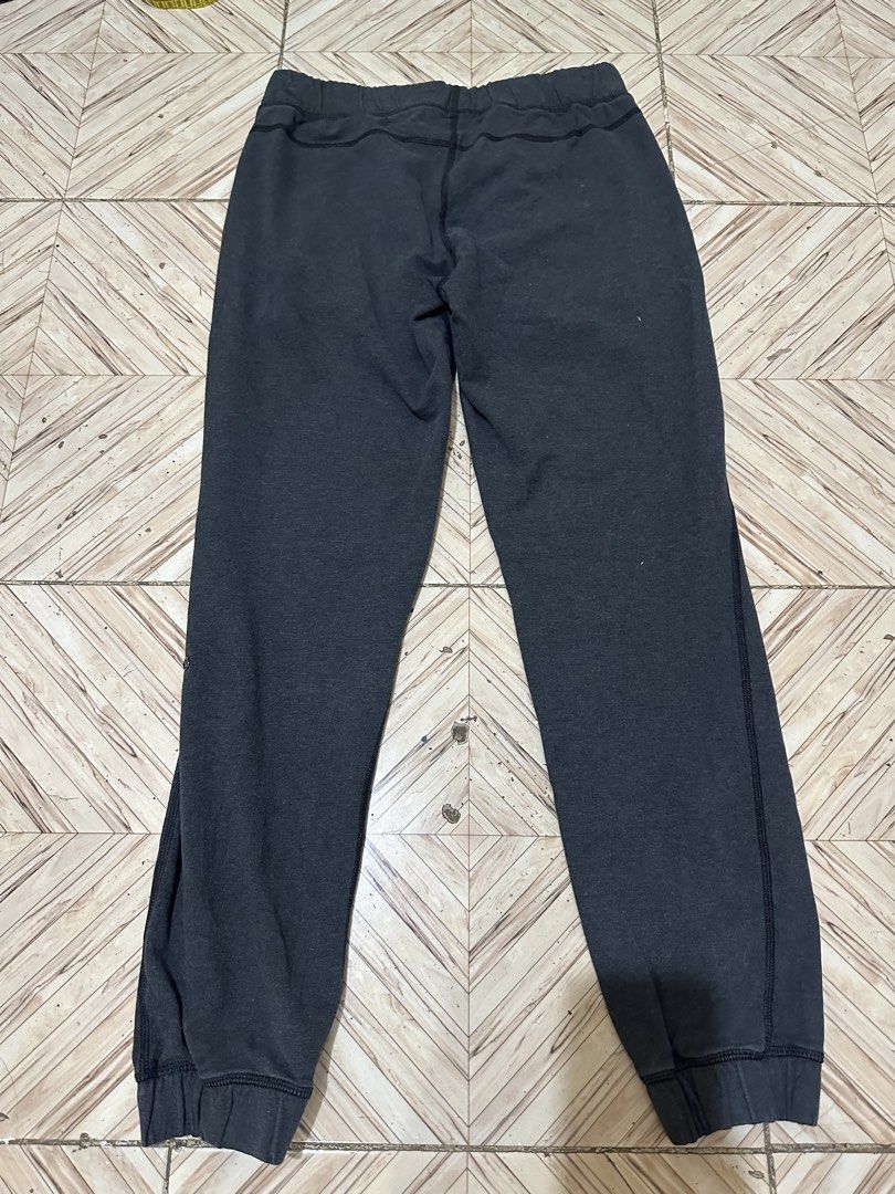 Lululemon Grey Jogger Pants Size 6 (Category: Other Bottoms) located in Angeles City. Submitted by alejeong27 (Listing ID 1460637716, Image 2). Description: - Grey Lululemon joggers - Size 6 - Elastic waistband with drawstring - Two side pockets - Cuffed ankles - Lululemon logo on left leg - Ideal for lounging or workouts.
