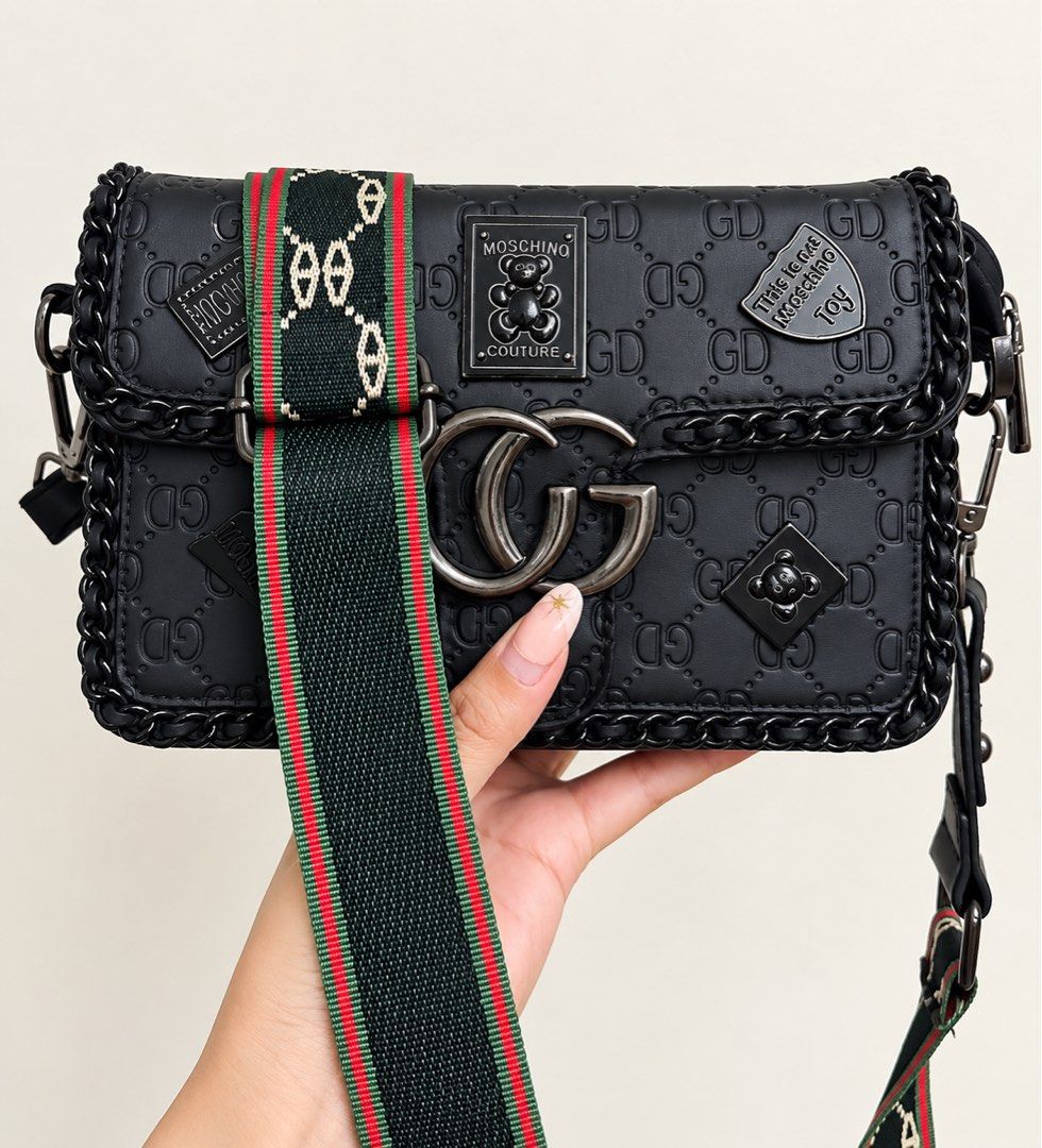 Luxury Style Black Crossbody Bag with Statement Strap (Category: Cross-body Bags) located in Binan City. Submitted by maharlikasonlineshop (Listing ID 1460690446, Image 1). Description: ✨ Chic, stylish, and made to stand out! ✨ Elevate your everyday look with this black embossed crossbody bag featuring a statement wide strap, braided chain details, and eye-catching hardware. Perfect for casual outfits, errands, travel, or adding a trendy touch to